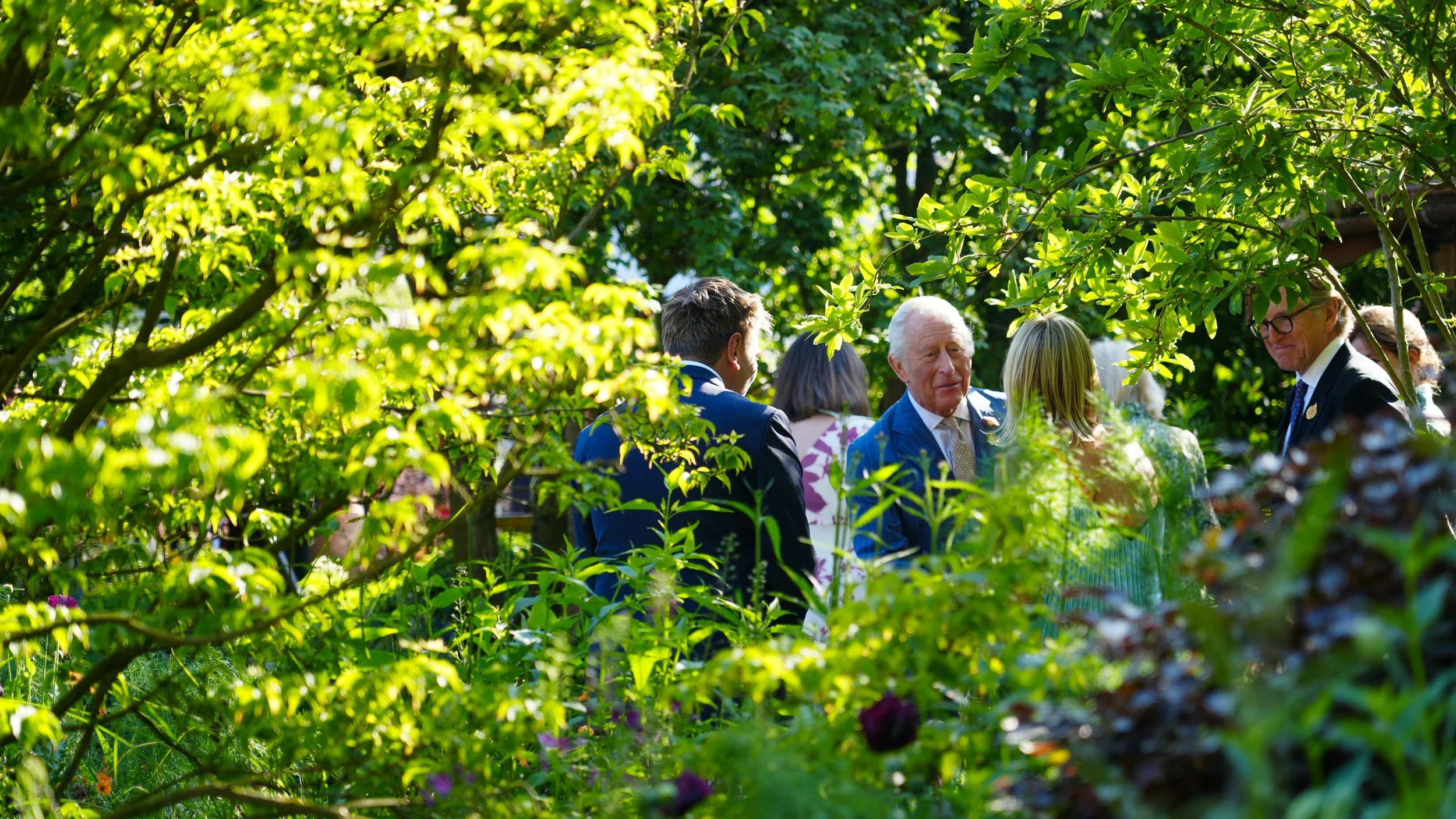 His Majesty The King meeting guests in a show garden at the RHS Chelsea Flower Show