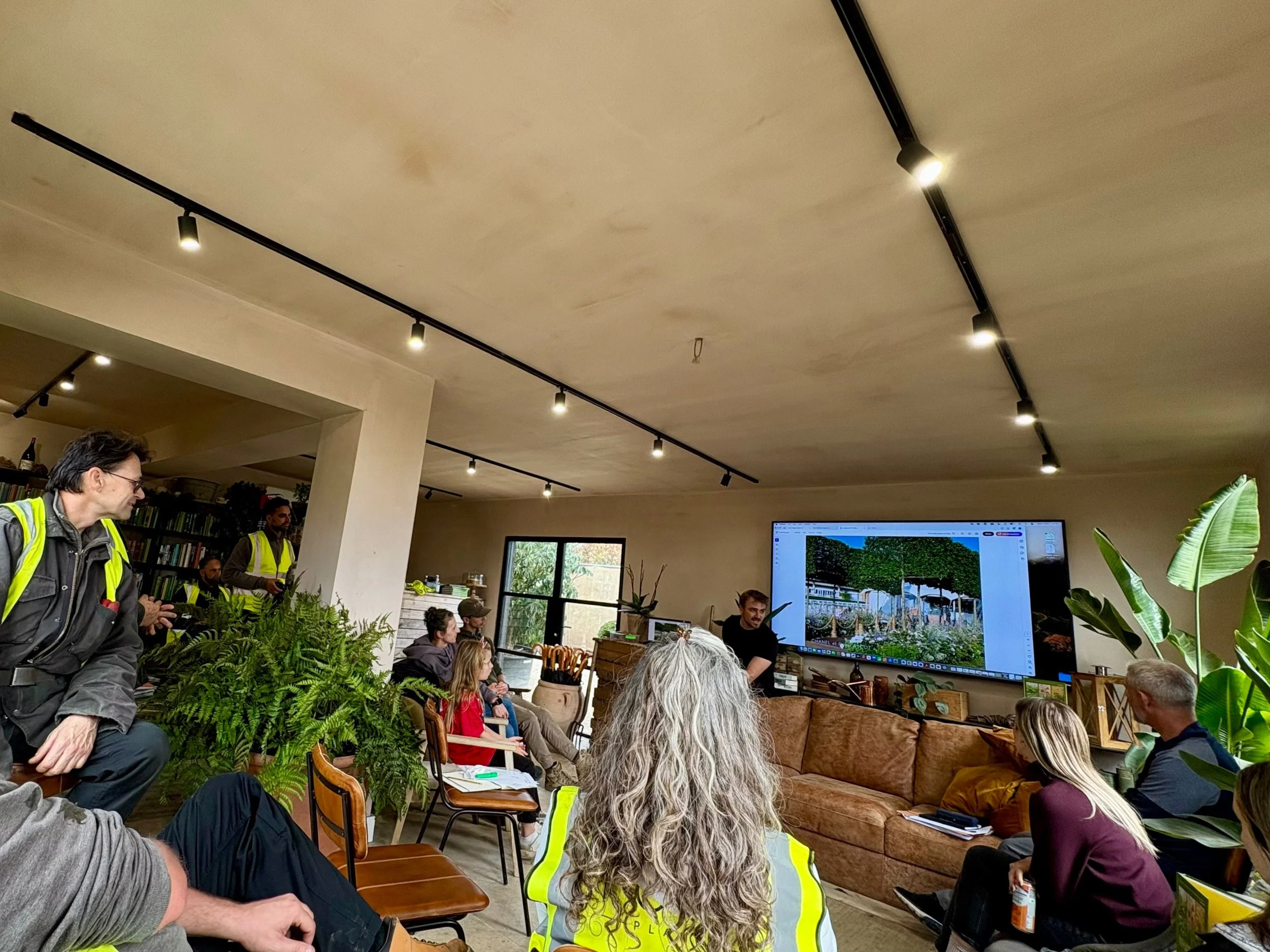 Guests listening to a talk in the Form Plants Row Town showroom