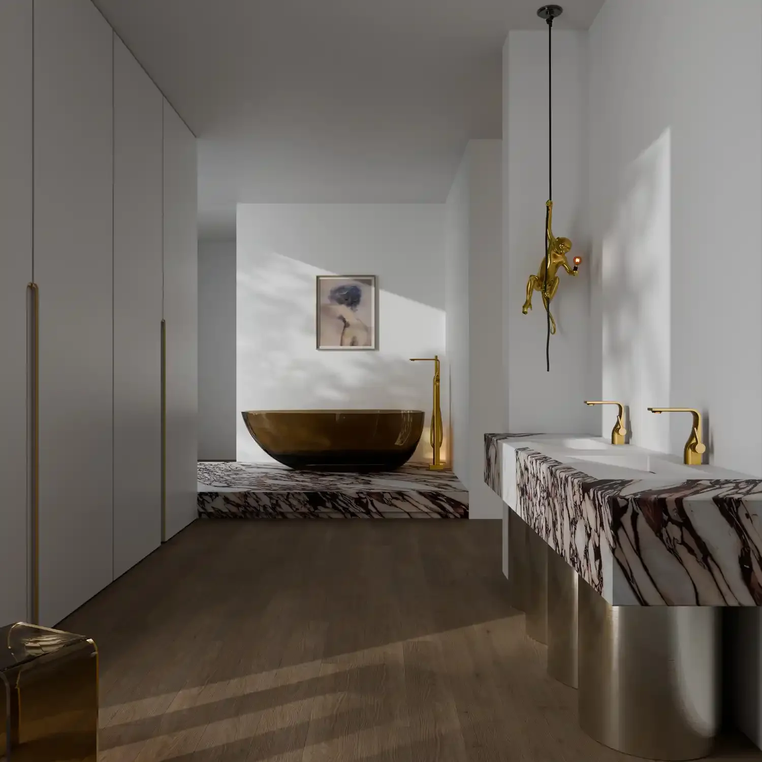 Modern bathroom with a marble countertop and gold fixtures. A gold bathtub is in the background, with a framed picture and a tall gold lamp nearby. There's a artwork on the wall and a hanging gold monkey sculpture with a light in its hand.