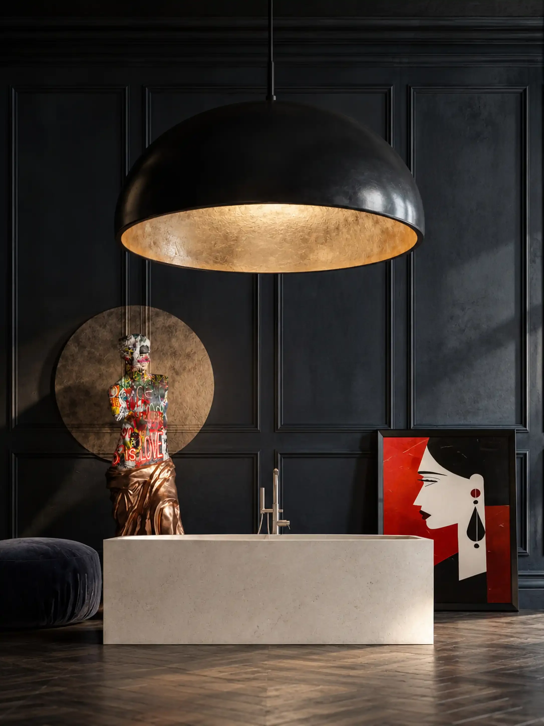 Interior of a modern kitchen with dark paneled walls, a large black and gold dome pendant light, a white kitchen island with a sink, a colorful abstract art piece of a woman’s face with earrings and red background, and a decorative item on a circular