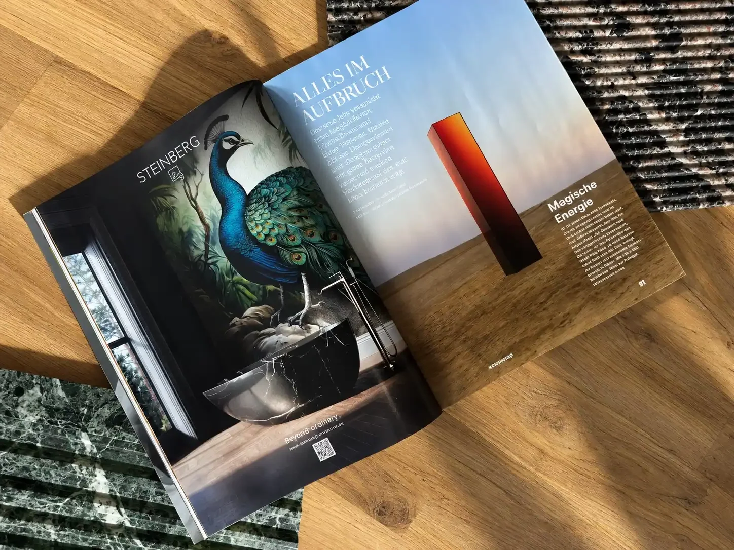 Open magazine featuring a colorful illustrated peacock on the left page and a bar graph on the right page with German text and a wooden background.