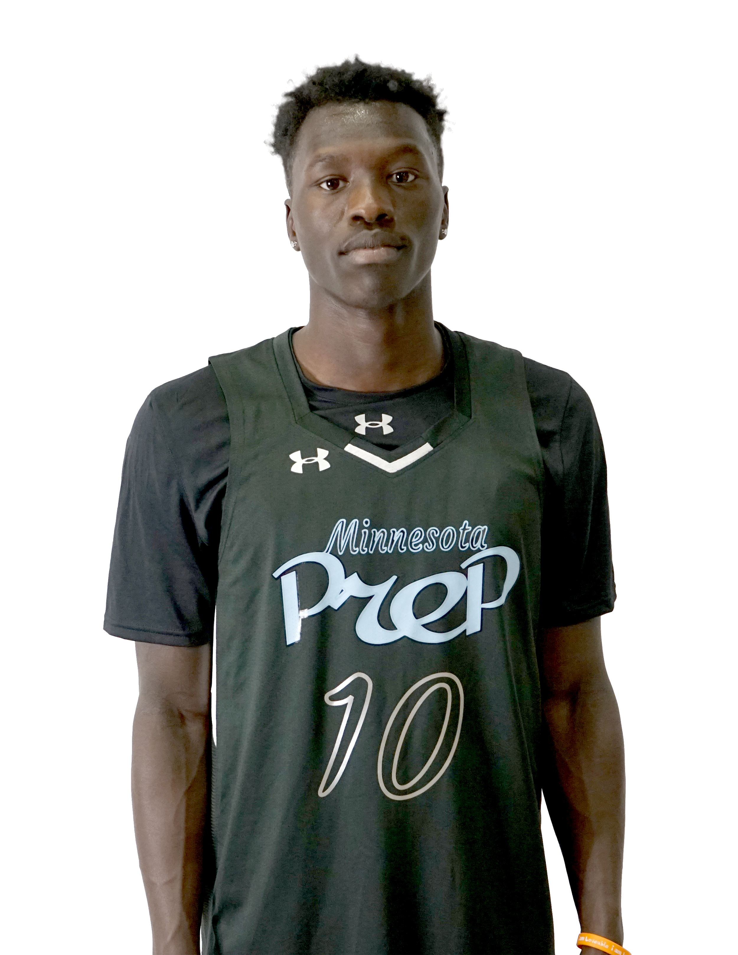 Young man with dark skin and short curly hair wearing a sports jersey that says "Minnesota" and "Pride" and a wristband that says "Loveable I am..." standing against a plain white background.