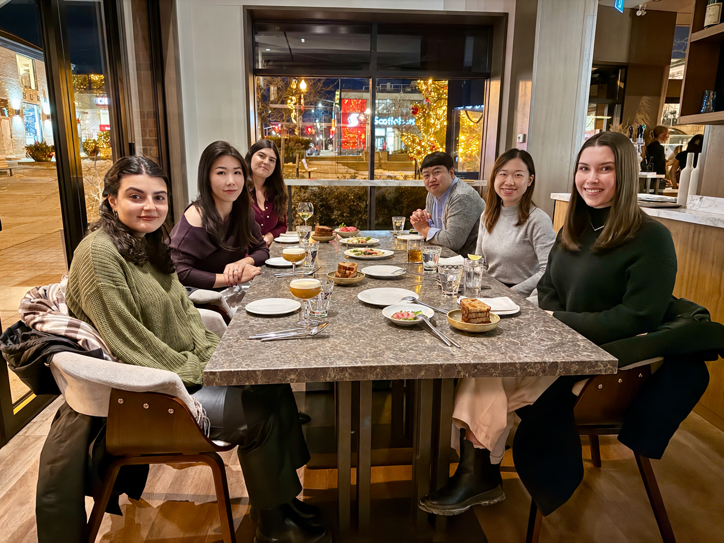 CNA colleagues sharing a team dinner.