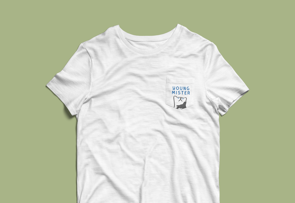 White crew-neck T-shirt with a chest pocket graphic reading “Young Mister” and a stylized dog illustration.