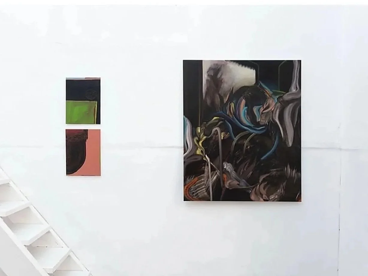 Installation view of paintings by Tom Plehn in Déjà Vu (2024) at Dialogue Gallery, Lisbon, featuring a large dark abstract composition alongside two smaller geometric paintings in green, black and pink.