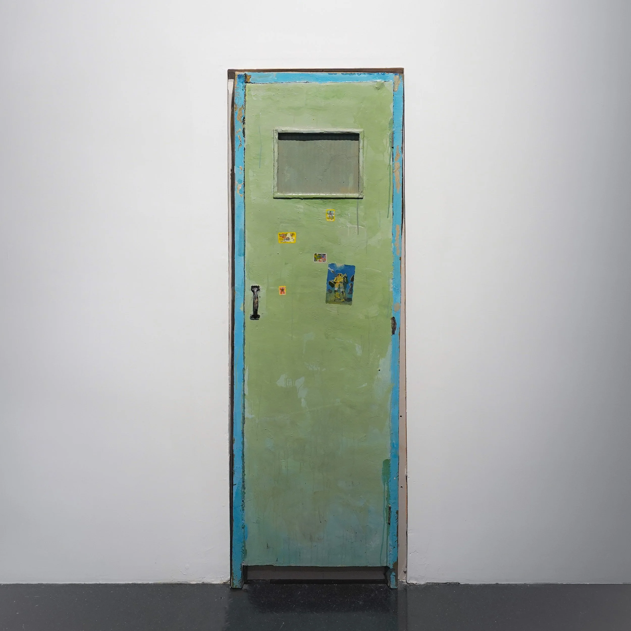 Installation view close up of a weathered green door artwork by Qiu Xiaofei in Danwei Unfolding (2025) at TANK Shanghai