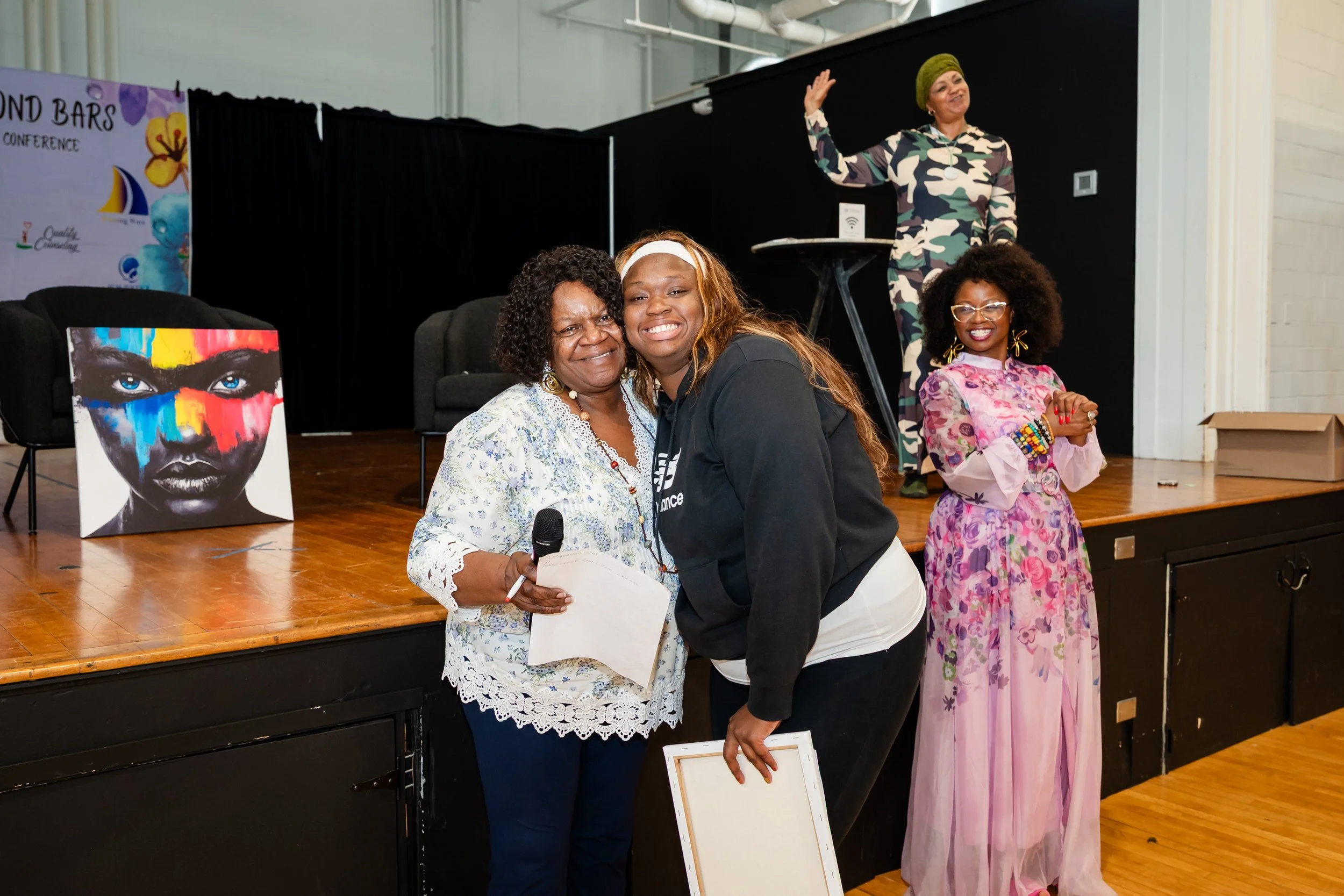 Barbara Fair, "Mother of the Movement" with Stop Solitary CT, celebrating with a raffle winner at the Blossoming Beyond Bars conference
