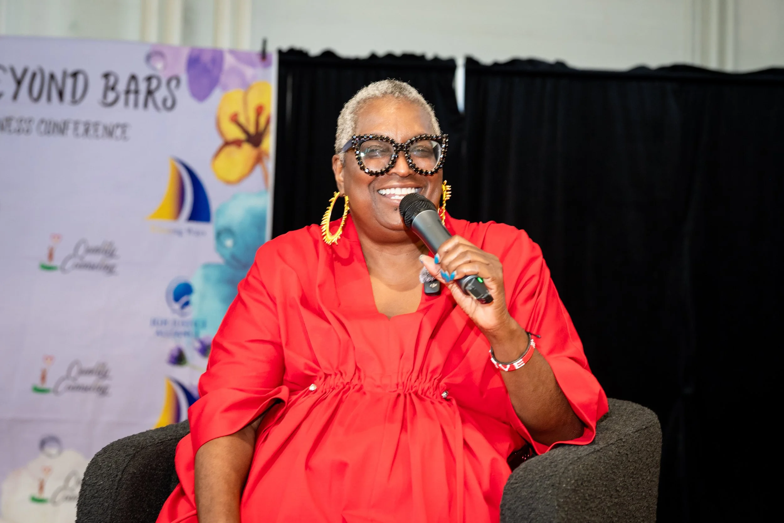 Babz Rawls Ivy moderating a conversation at the Blossoming Beyond Bars Women's Reentry Wellness Conference