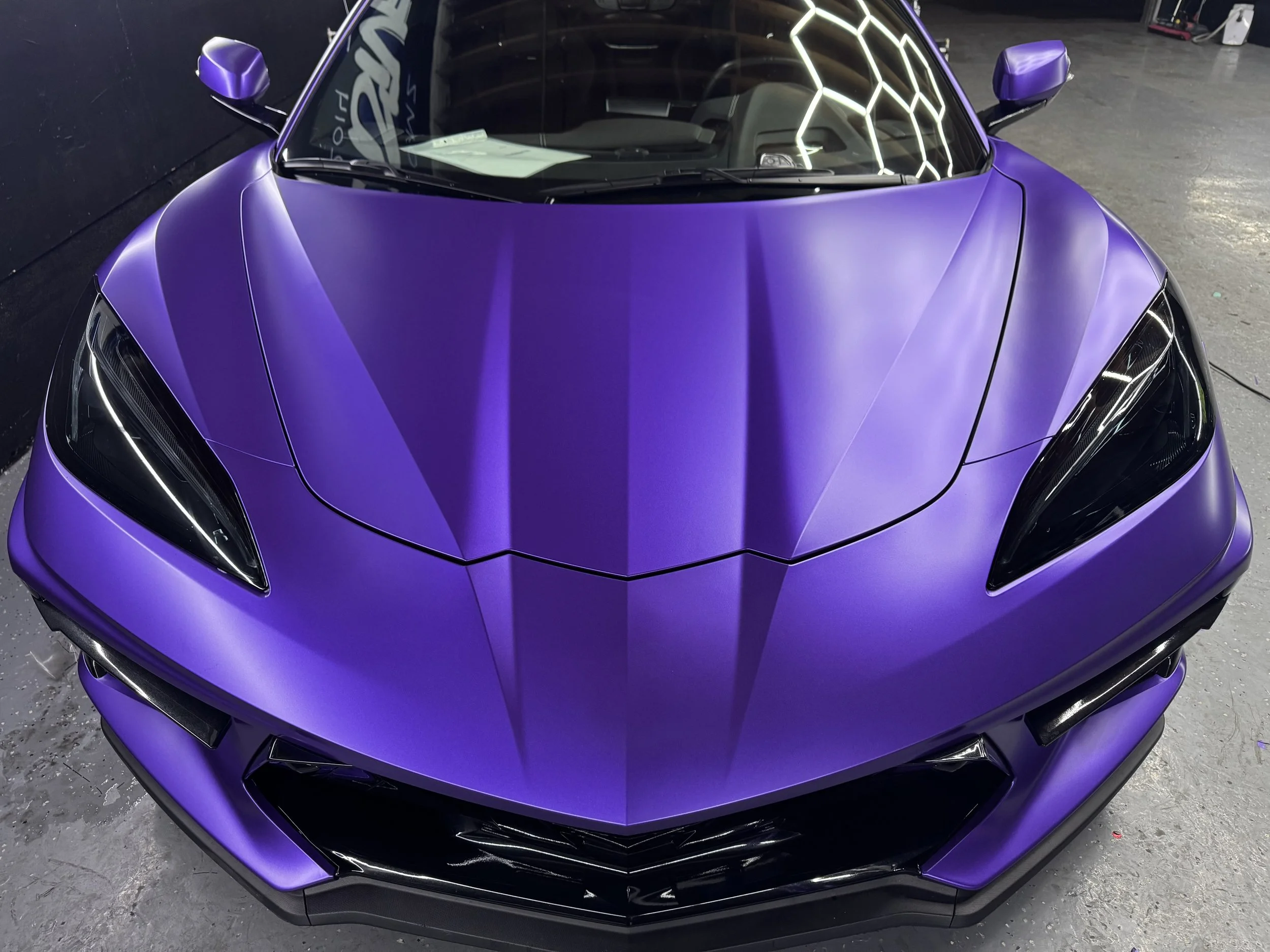 Close-up of purple Lamborghini hood with satin paint protection film at Xclusive Auto Customz in Santee, CA