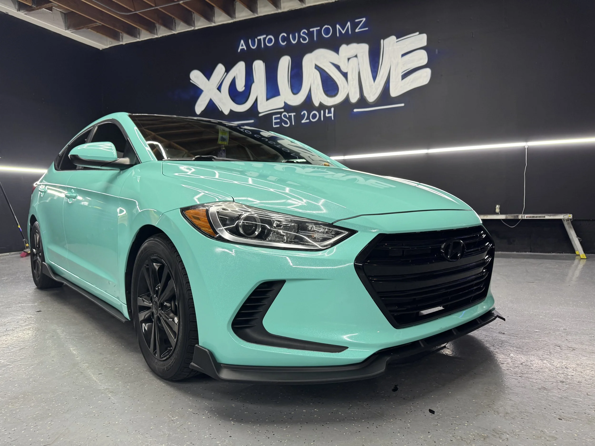 Teal Hyundai Elantra with full color-change vehicle wrap at Xclusive Auto Customz in Santee, CA