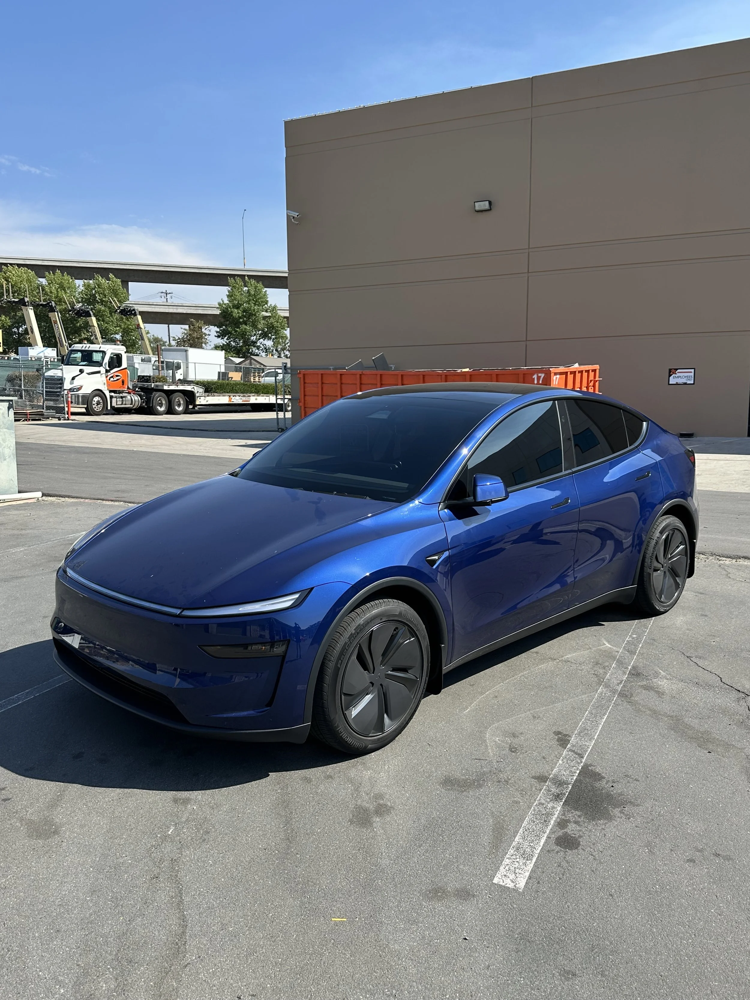 Blue Tesla with gloss paint protection film at Xclusive Auto Customz in Santee, CA