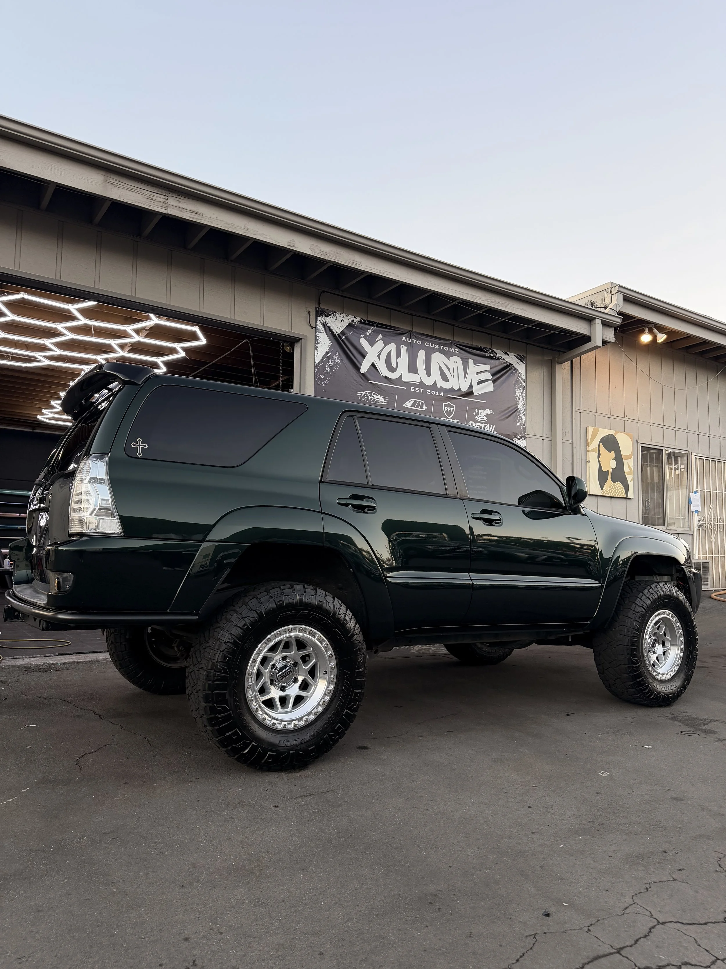 Black Toyota 4Runner with custom wrap at Xclusive Auto Customz in Santee, CA