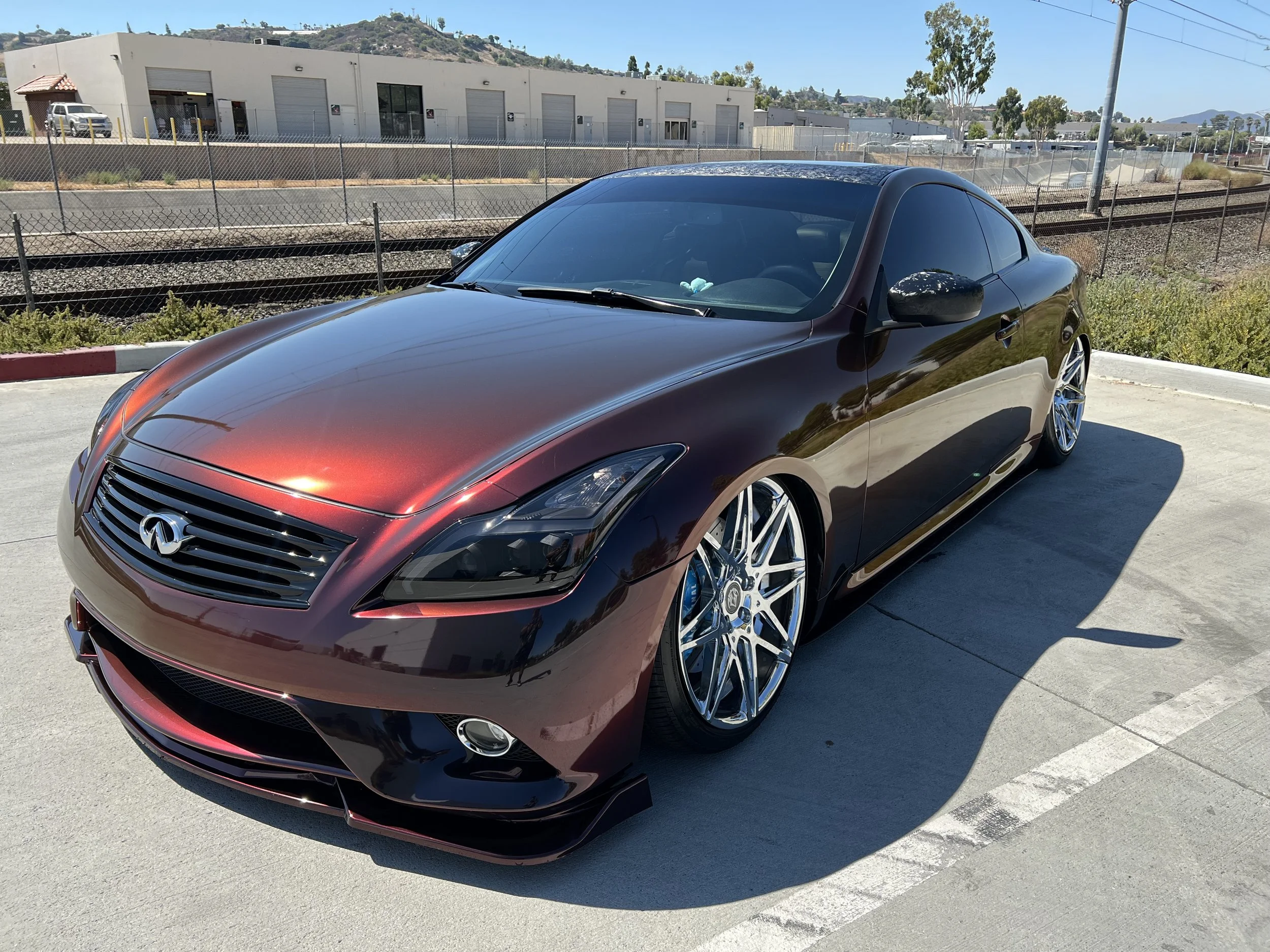 Magenta Infiniti G37 coupe with custom wrap at Xclusive Auto Customz in Santee, CA