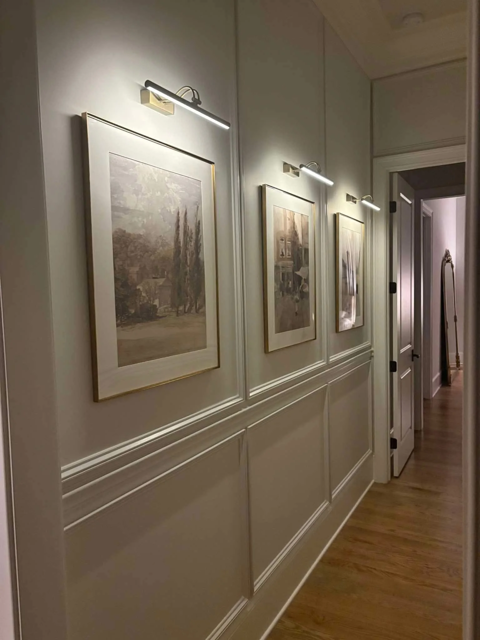 Custom picture-frame wall molding with a coordinated painted finish in a Middle Tennessee hallway