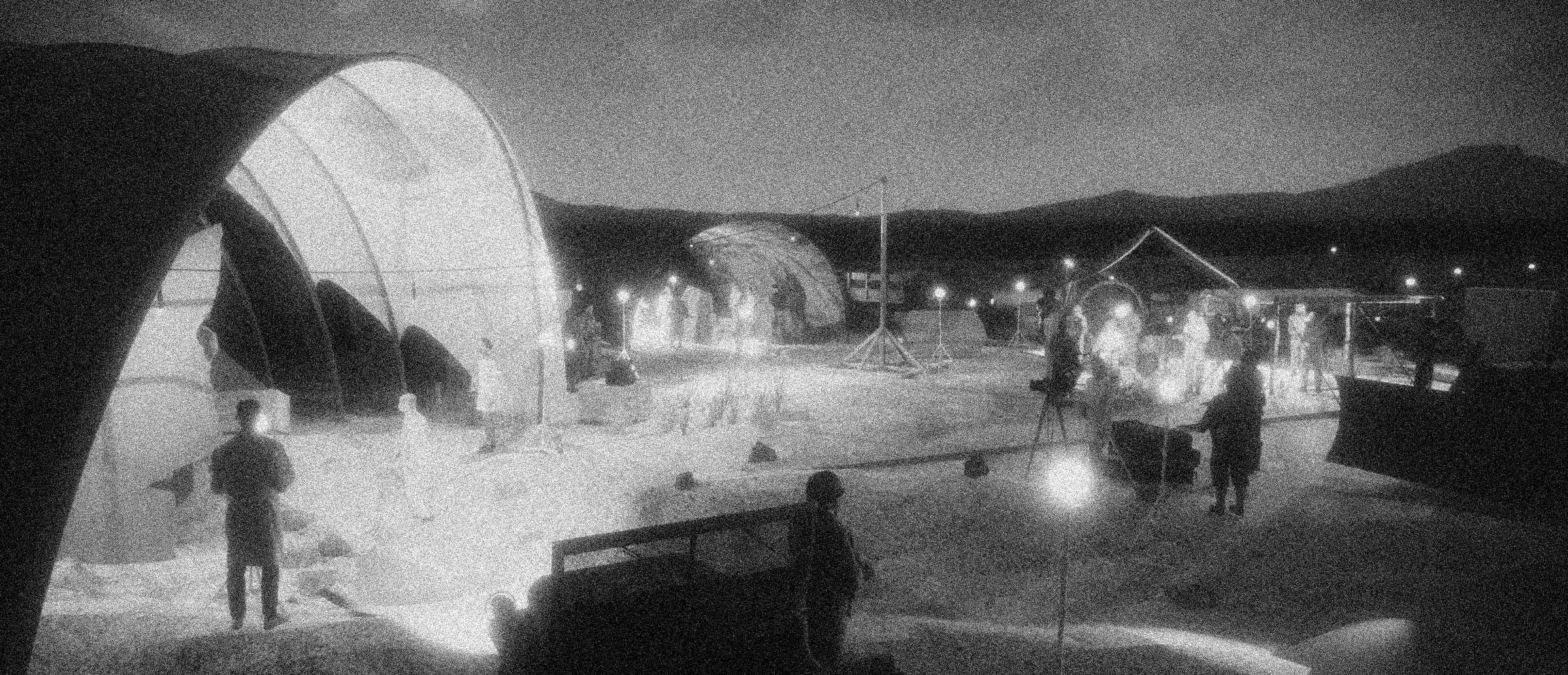 Nighttime outdoor scene with tents, stage, and people gathered, illuminated by string lights.