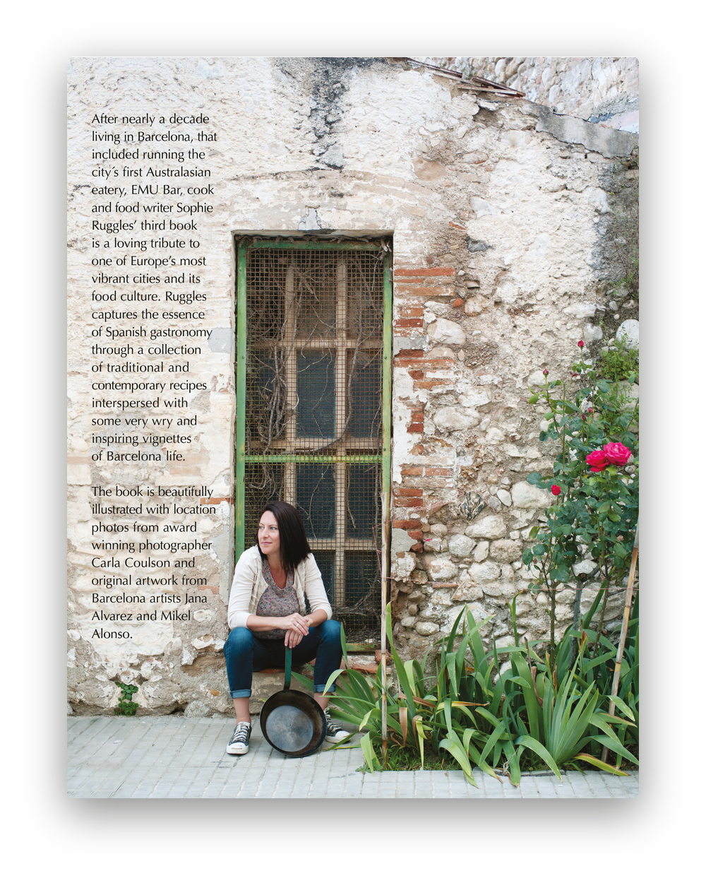 Back cover of My Barcelona Kitchen: Sophie Ruggles sitting by a green window in an old stone wall, holding a paella pan, with roses beside her.