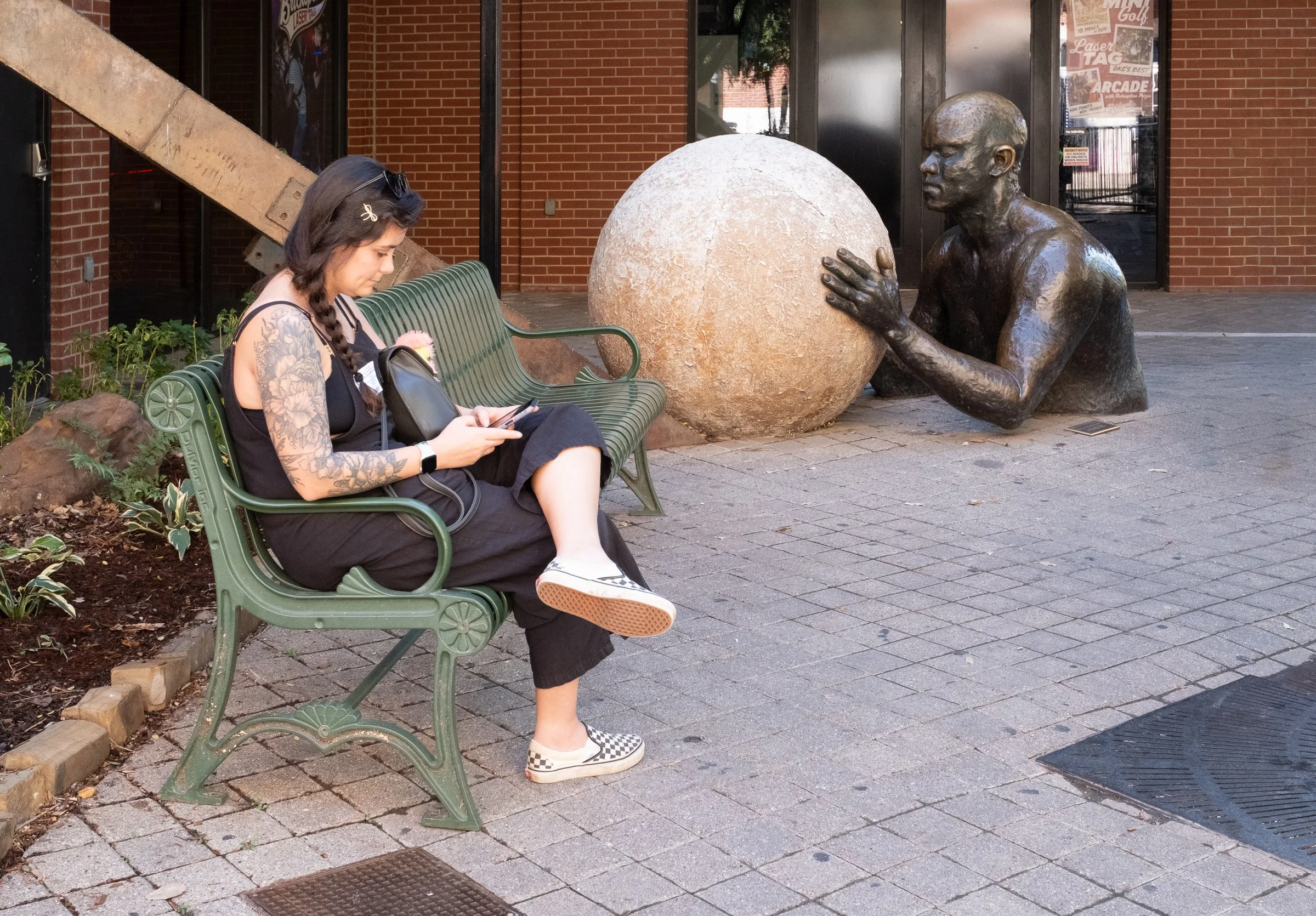 At the OKC riverwalk - "Hey, Sisyphus here. Can't you even watch while I  roll this stone up this incredibly difficult slope?"