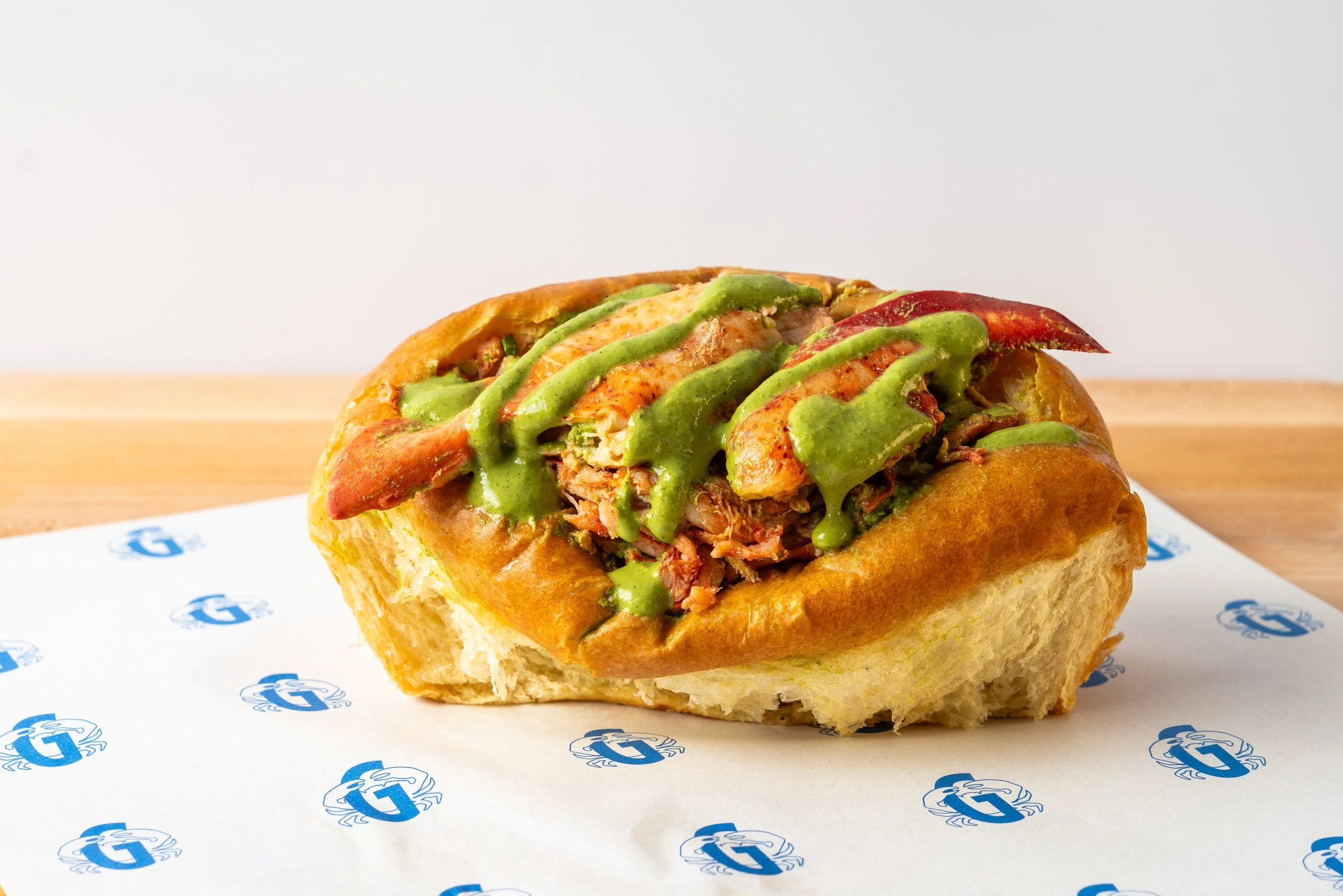 Lobster roll with green sauce