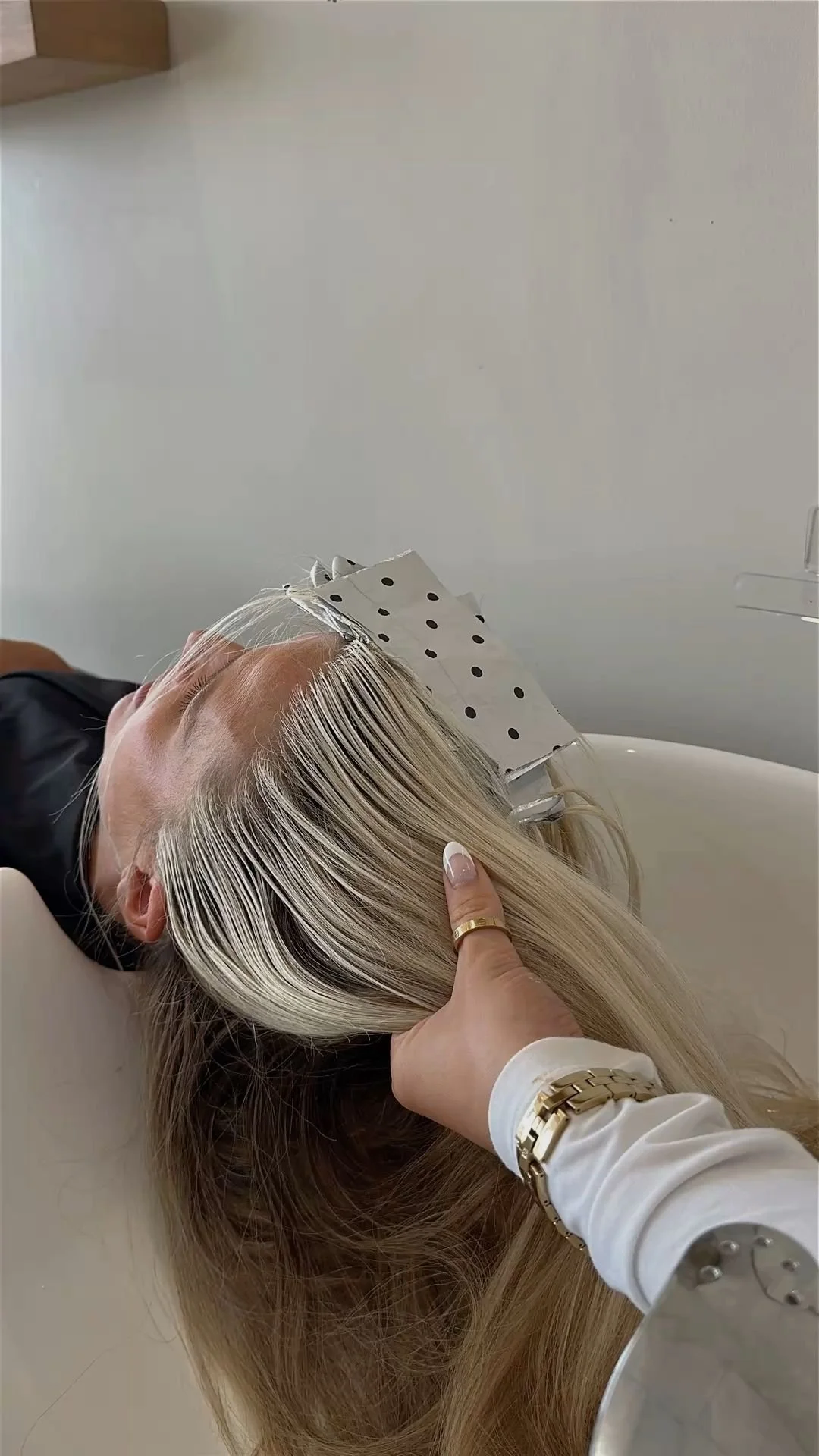 Blonding service with foil highlights for bright, dimensional blonde hair.