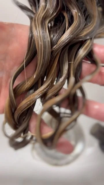 Professional perm service creating natural-looking curls, texture, and body.