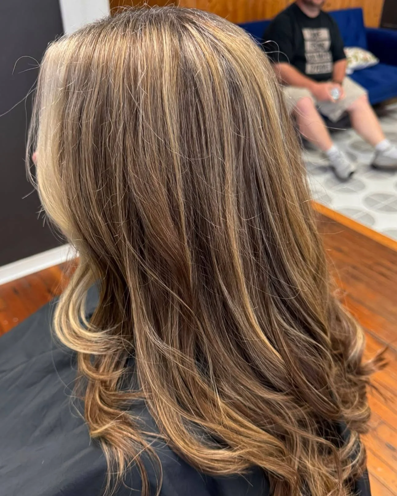 From dark + grown out to softer, brighter, and easier to maintain 

Her goal was to go lighter, blend the gray, and create a color that would let her go longer between appointments.

She came in with overgrown roots, noticeable gray, and older darker