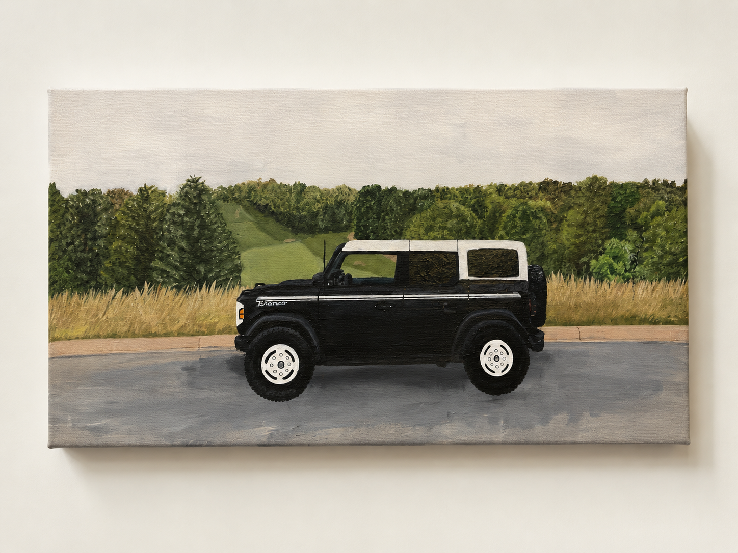Painting of a black and white vintage Toyota FJ Cruiser SUV parked on a road with a background of grassy fields, trees, and hills under a cloudy sky.