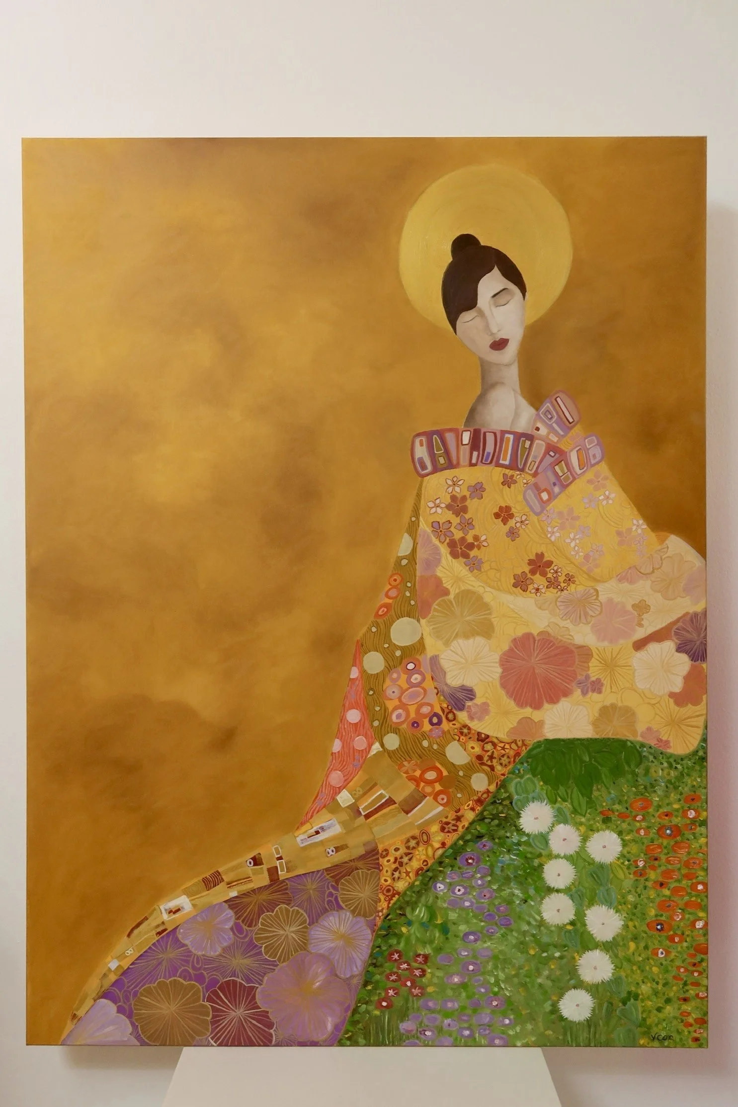 A painting of a woman with short dark hair, closed eyes, red lips, and a yellow halo behind her head, dressed in a colorful kimono adorned with floral and geometric patterns, against a yellow background.