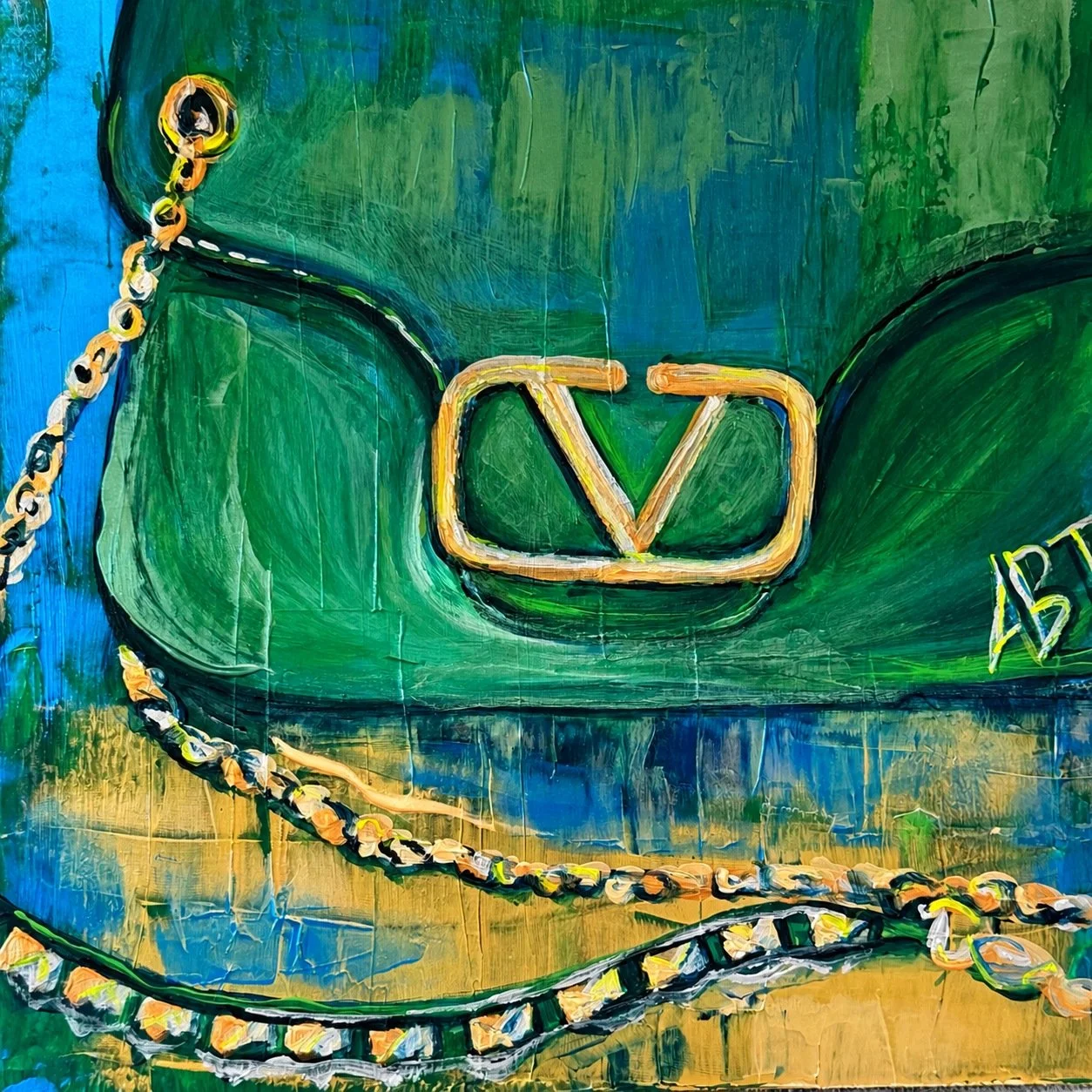 Emerald & Gold
A green handbag with gold hardware and draped chains.
Available
