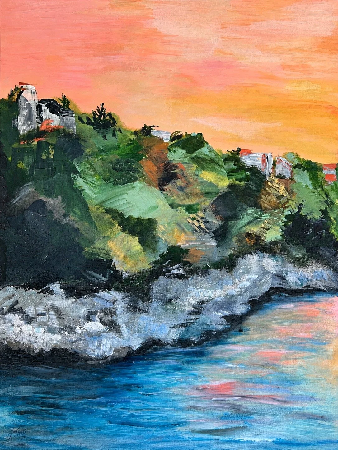 Coastal Cliffs at Sunset, an original painting by Annette “Nettie” Tierney of a hillside village above rocky shoreline under a coral sky