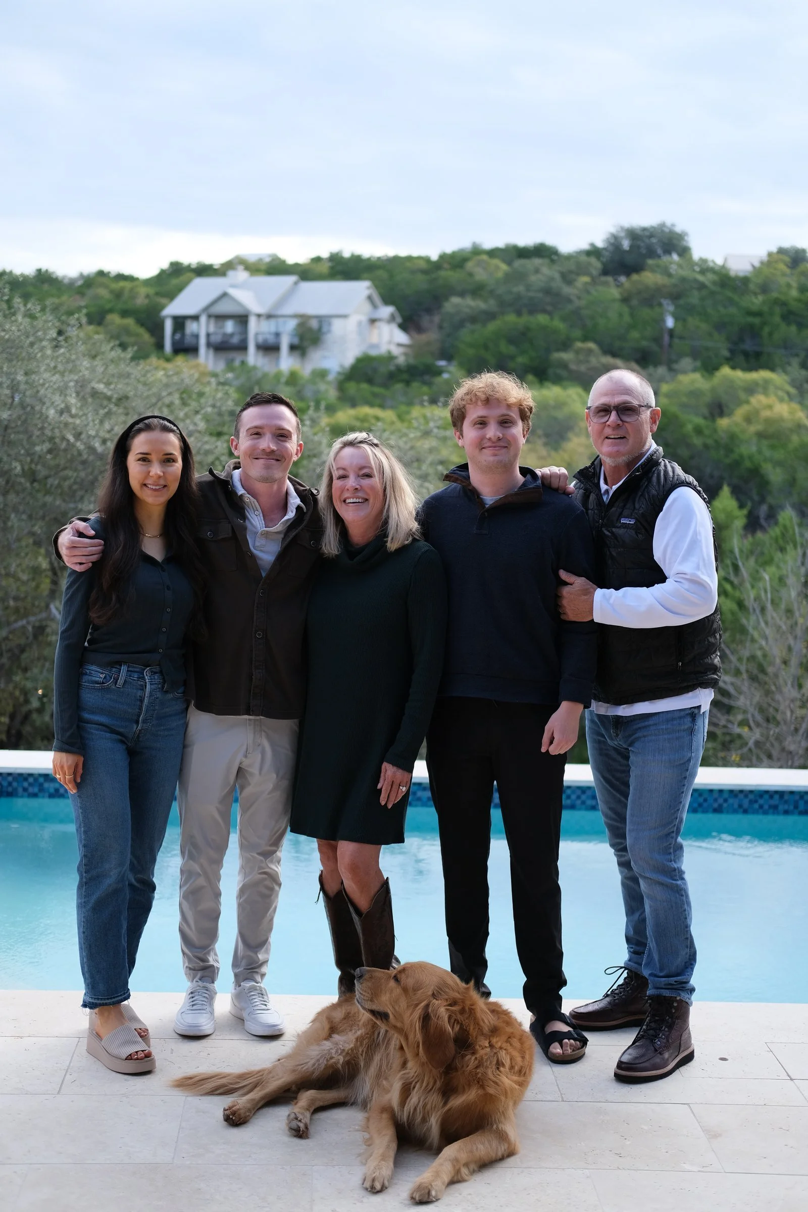 Annette “Nettie” Tierney, center, with her family and their golden retriever