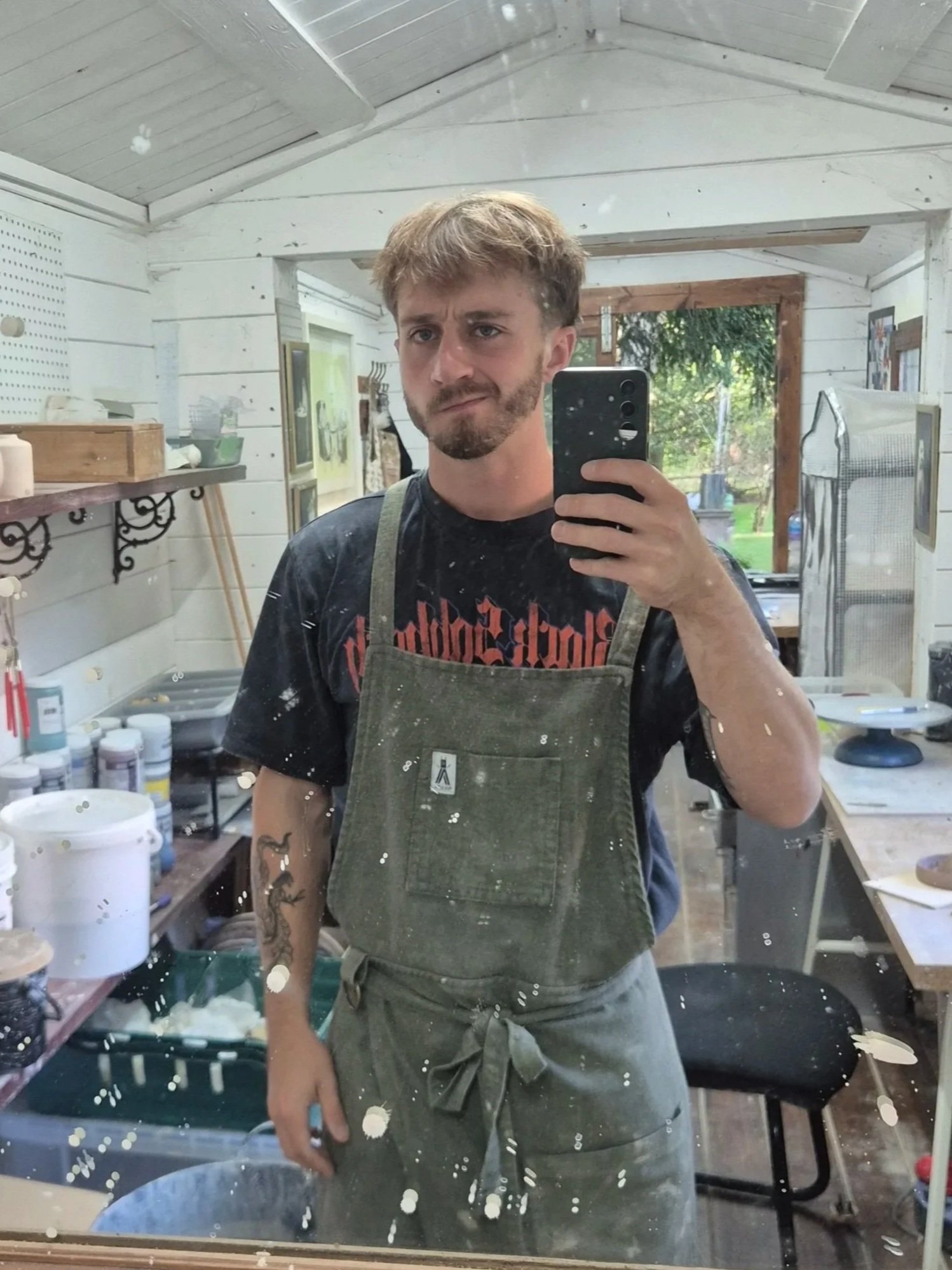 a picture of a potter in his ceramic studio