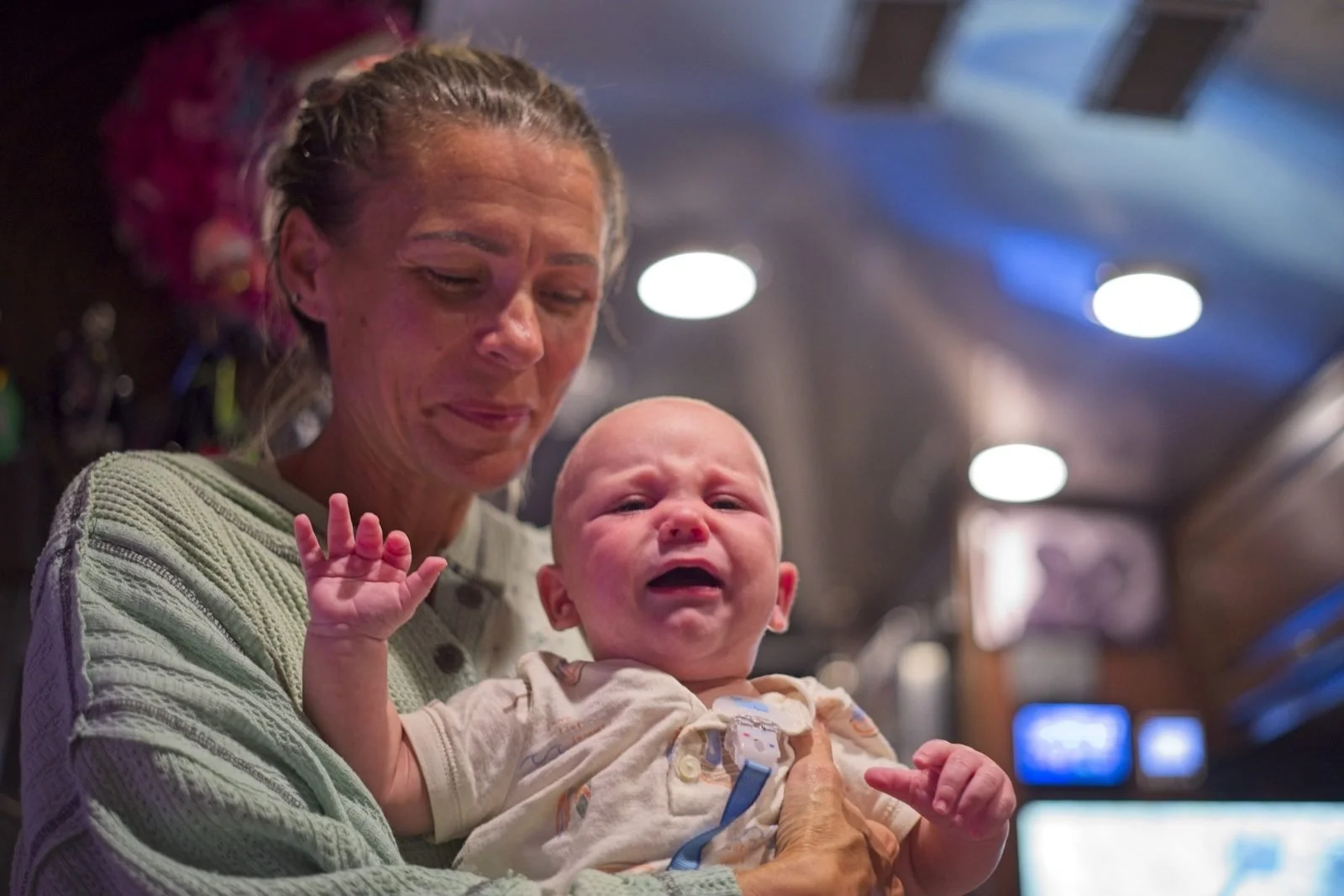 Gigi comforting a crying baby Koby