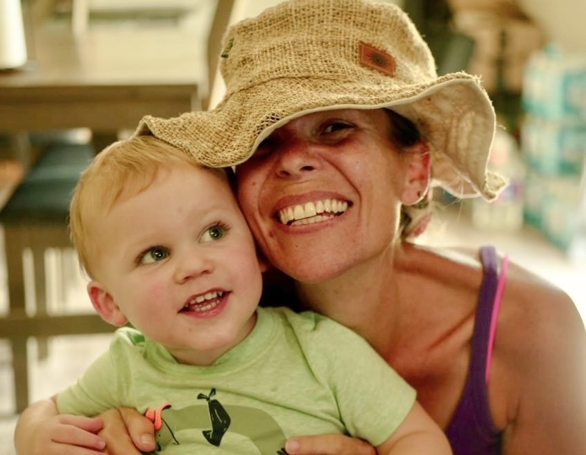 Gigi in her sun hat, cheek to cheek with Knox