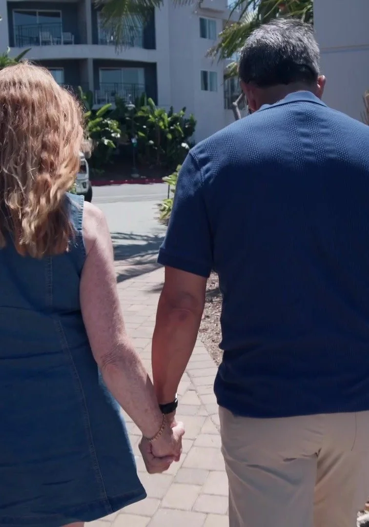Couple walking hand in hand in San Diego, from the Anchored in Love brand film