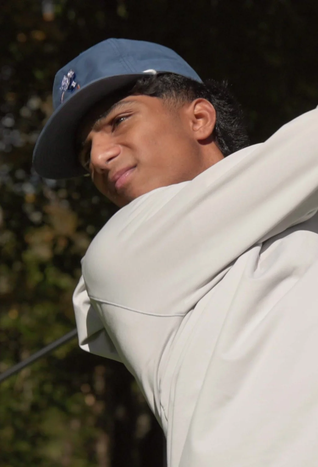 Arnav Rao mid golf swing, from a golf film by Charlie Reitzas Productions