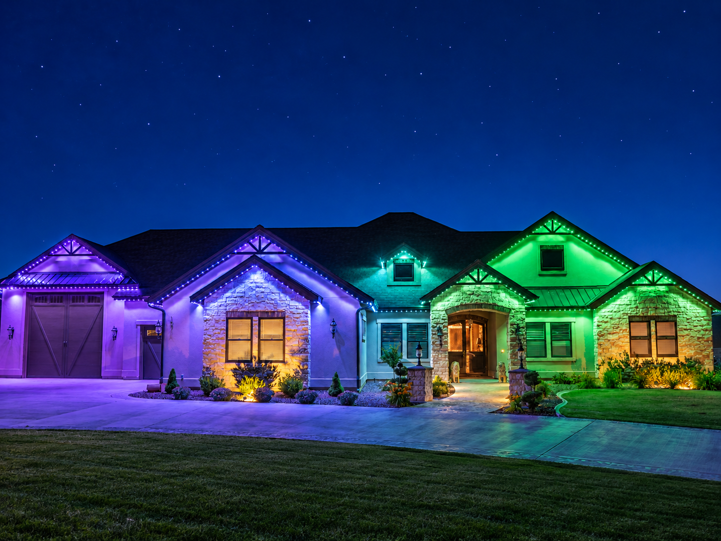 Purple, blue, and green permanent lighting illuminates the garage, gables, and entrance of a home at night.