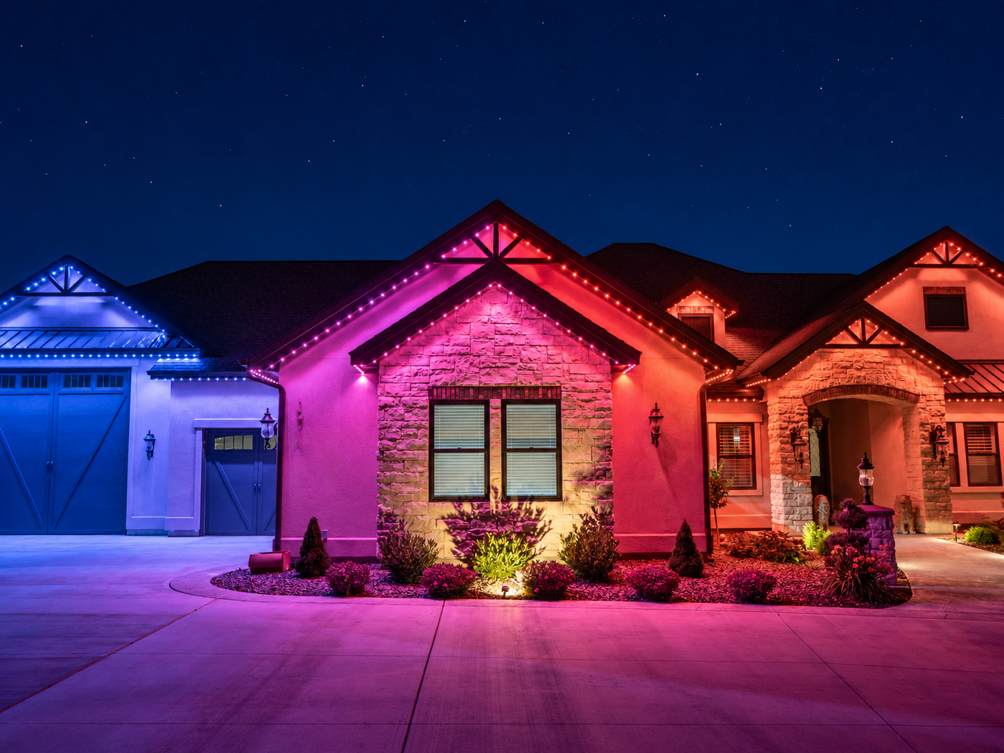 Blue, pink, and red permanent lights illuminate adjoining gables and the front entrance of a stone home.