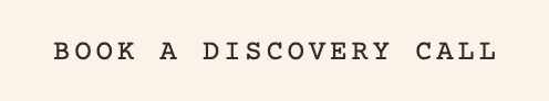 Text reading 'BOOK A DISCOVERY CALL' on a plain background.