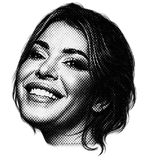 Black and white photo of Coco with dark hair, smiling.