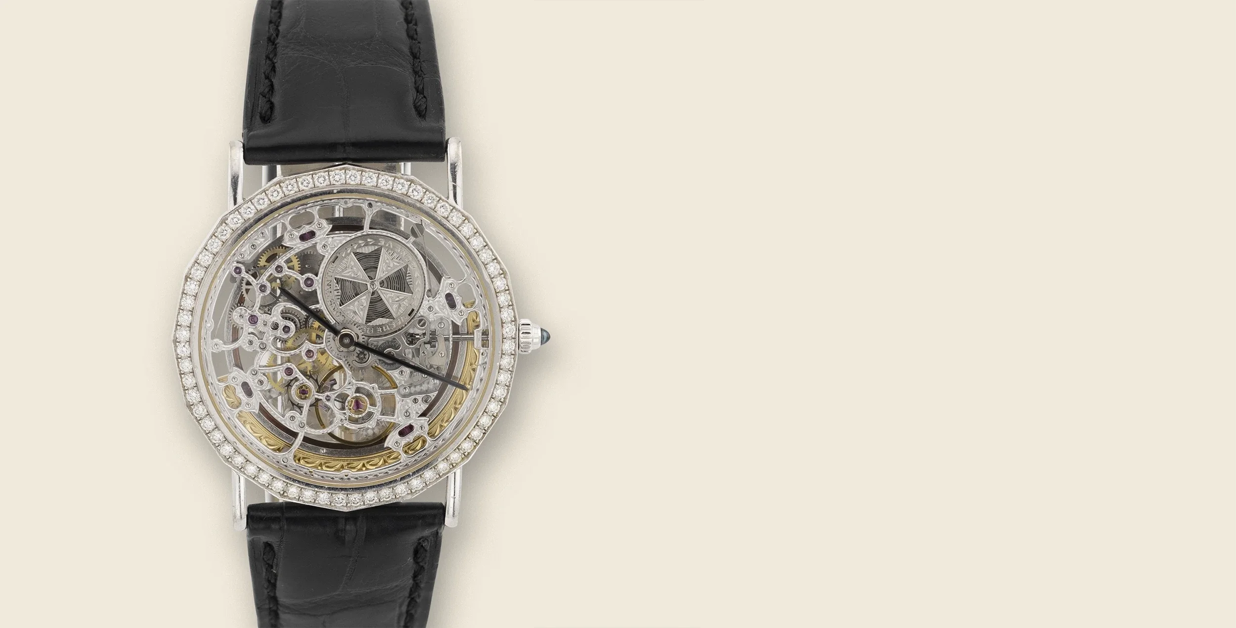 A luxury wristwatch with a black leather strap, a diamond-encrusted bezel, and a skeleton dial showing intricate internal gears and mechanisms.