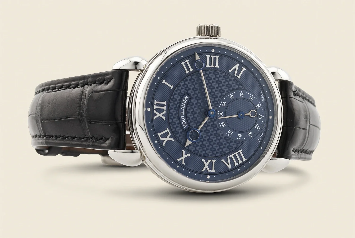 A luxury wristwatch with a black leather strap