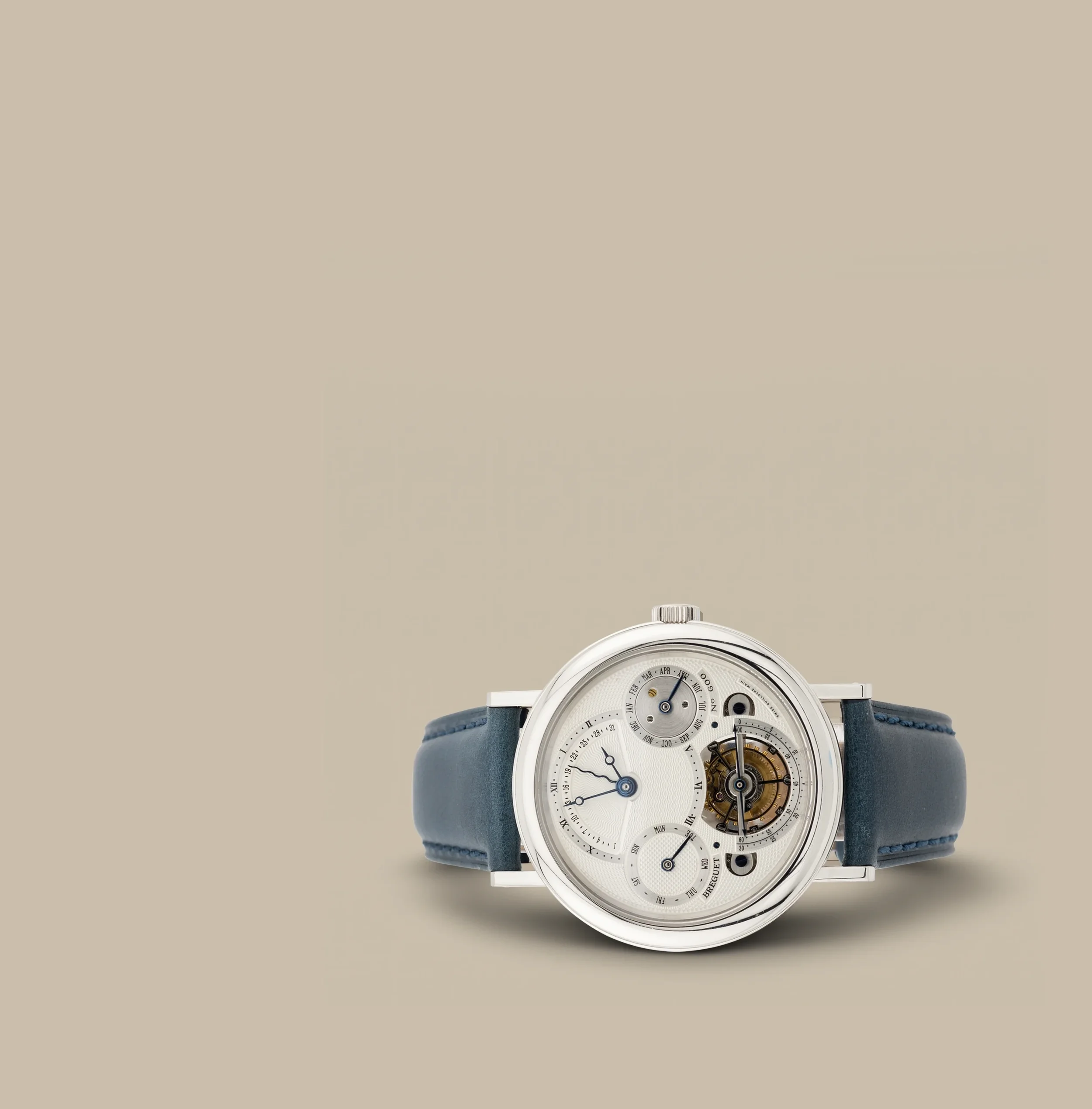 luxury wristwatch with multiple dials and a blue strap