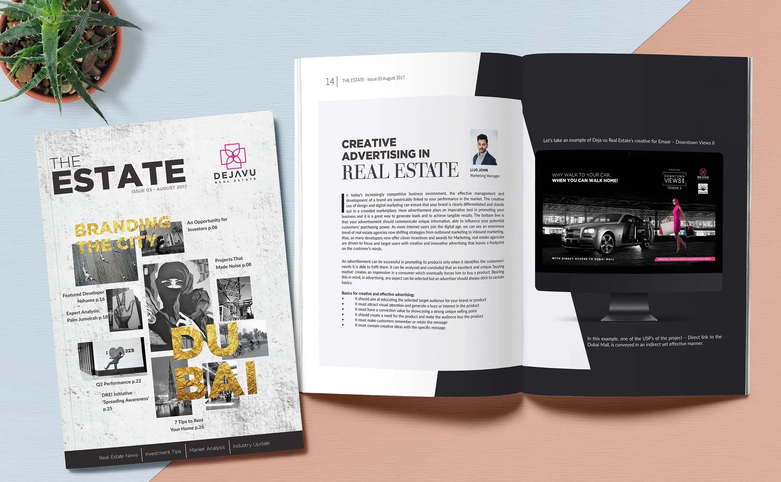 A magazine titled 'The Estate' Issue 03 August 2017 with featured articles about branding the city, project noise, and rental tips, alongside an open magazine page discussing creative advertising in real estate, including an example of Dubai real estate advertising on a computer monitor, and a potted succulent on a light-colored wooden surface.