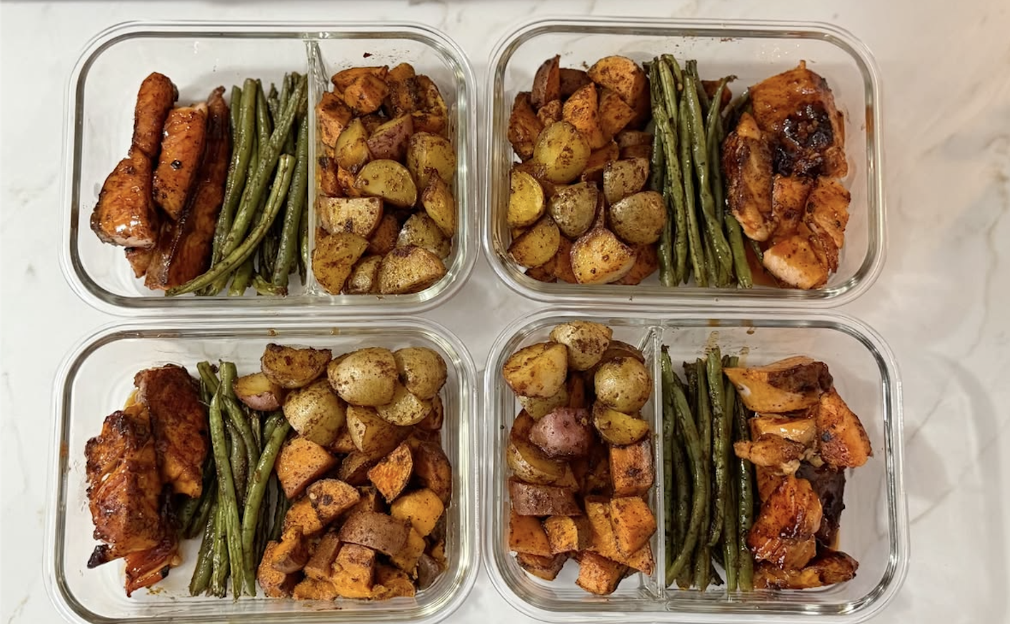 Louisville healthy meal prep containers filled with roasted salmon, green beans, and roasted potatoes. health conscious meal prep in Louisville.