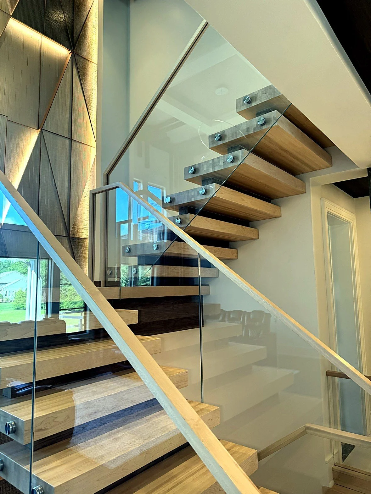 The Blockley stacked-block floating staircase, finished flight with glass railing