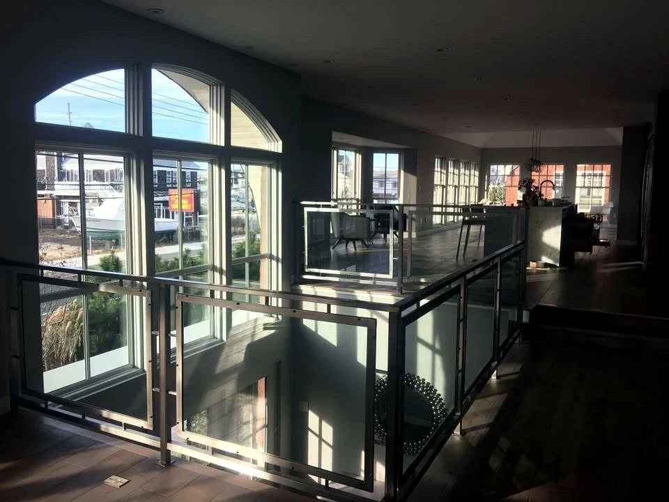 Glass railing in steel frames