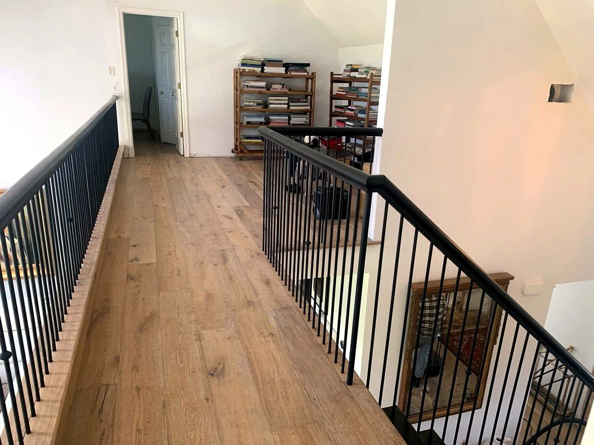 Loft walkway with black metal railing
