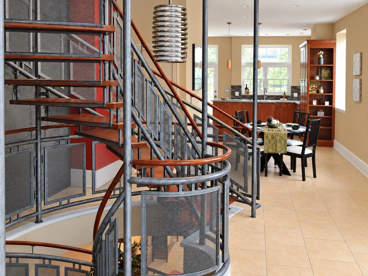 Curved stair with mesh railing