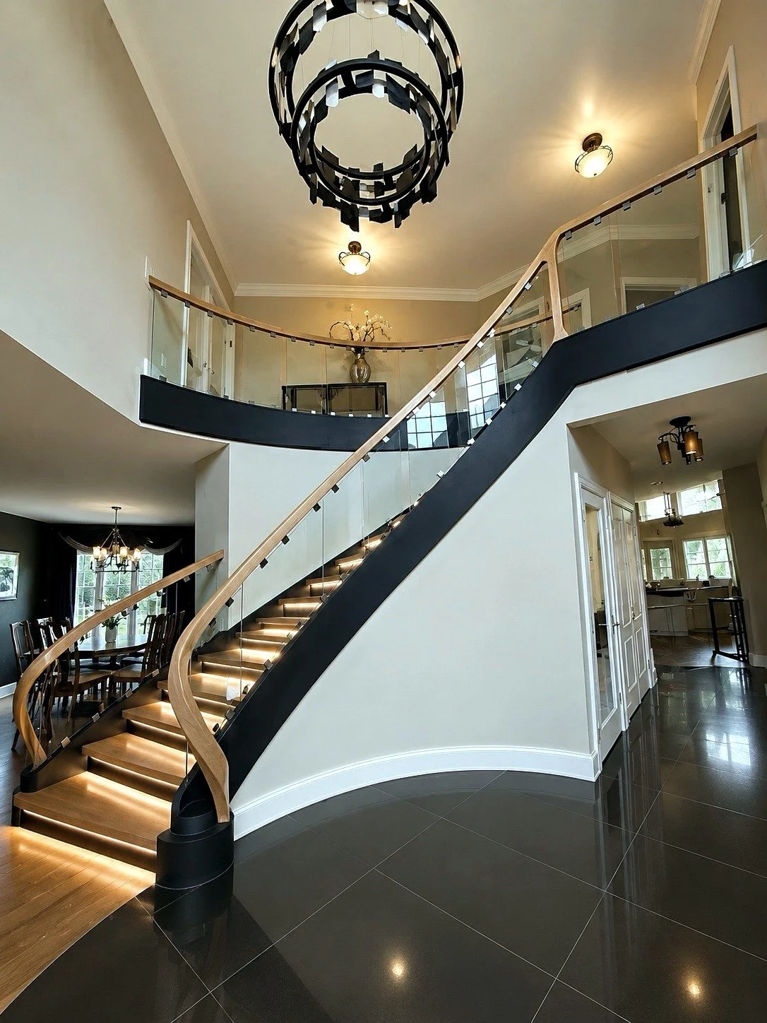 Curved floating stair with glass railing