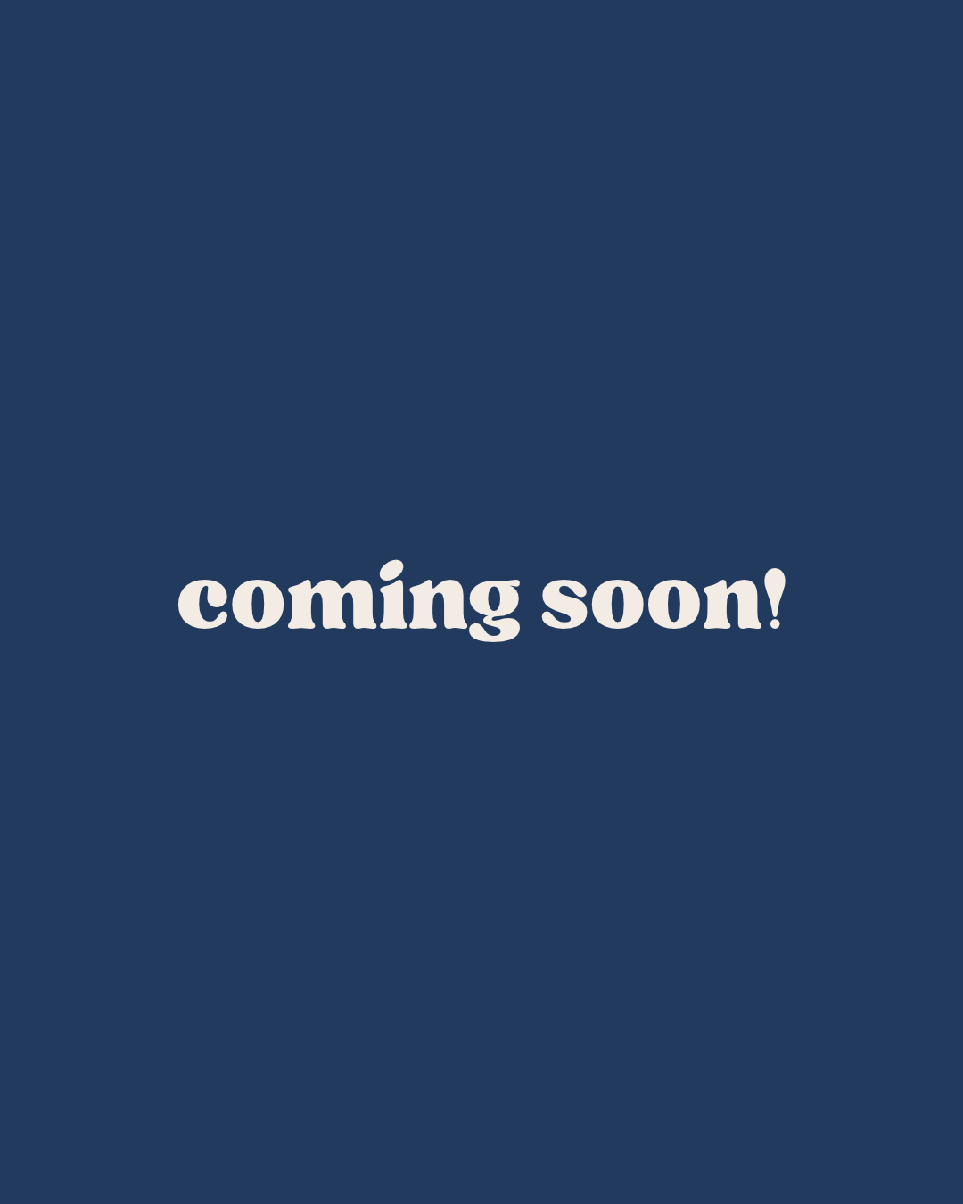 Coming soon text in cream lettering on a navy blue background.